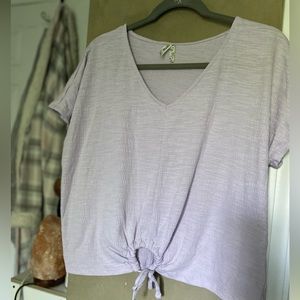light purple top, with circle tie at bottom